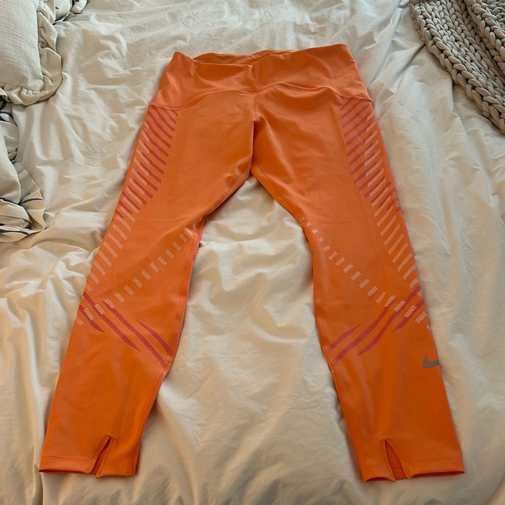 Nike never been worn tight fit mid rise 7/8 length tangerine orange workout